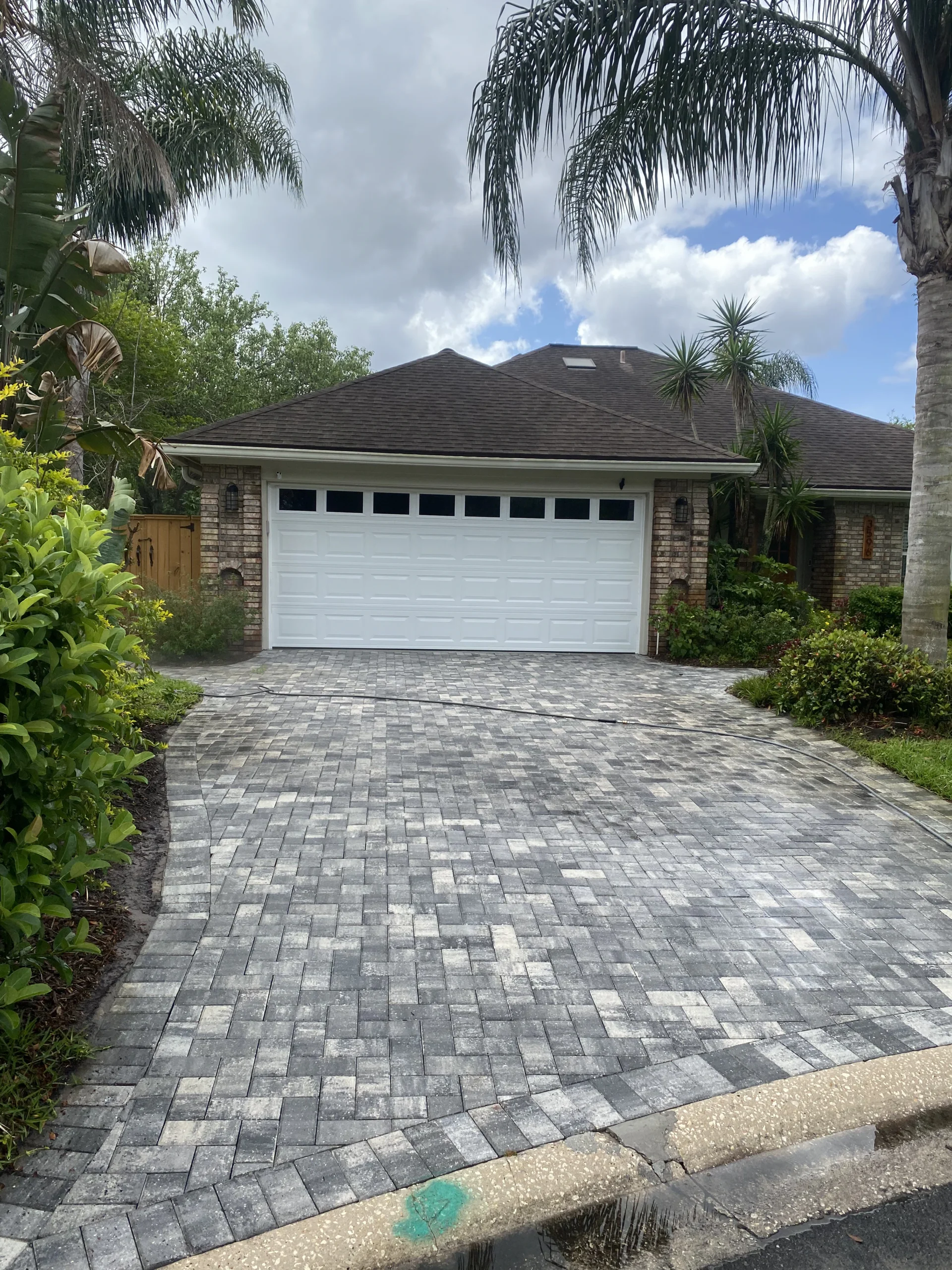 Residential paver driveway evaluated for resealing in Jacksonville Beach, FL