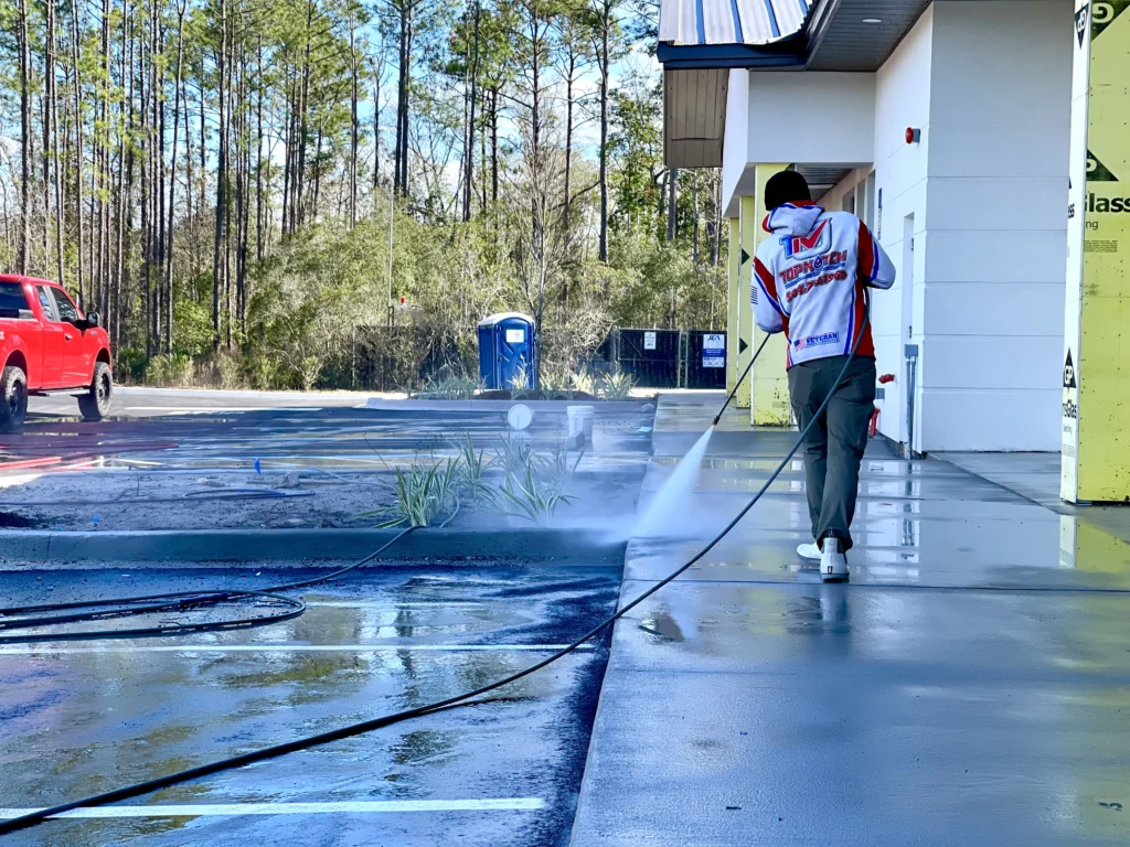 Professional pressure washing service cleaning a home's exterior in Jacksonville Beach, FL