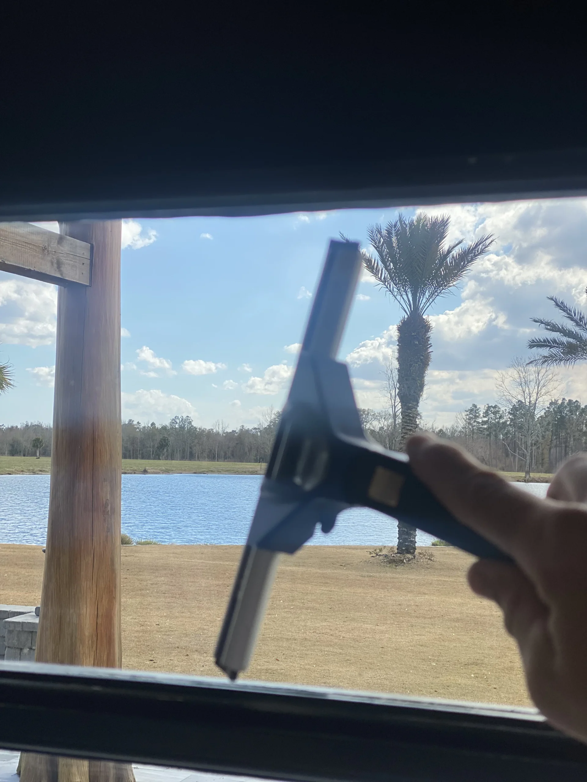 Professional squeegee detailing window glass in Jacksonville Beach, FL
